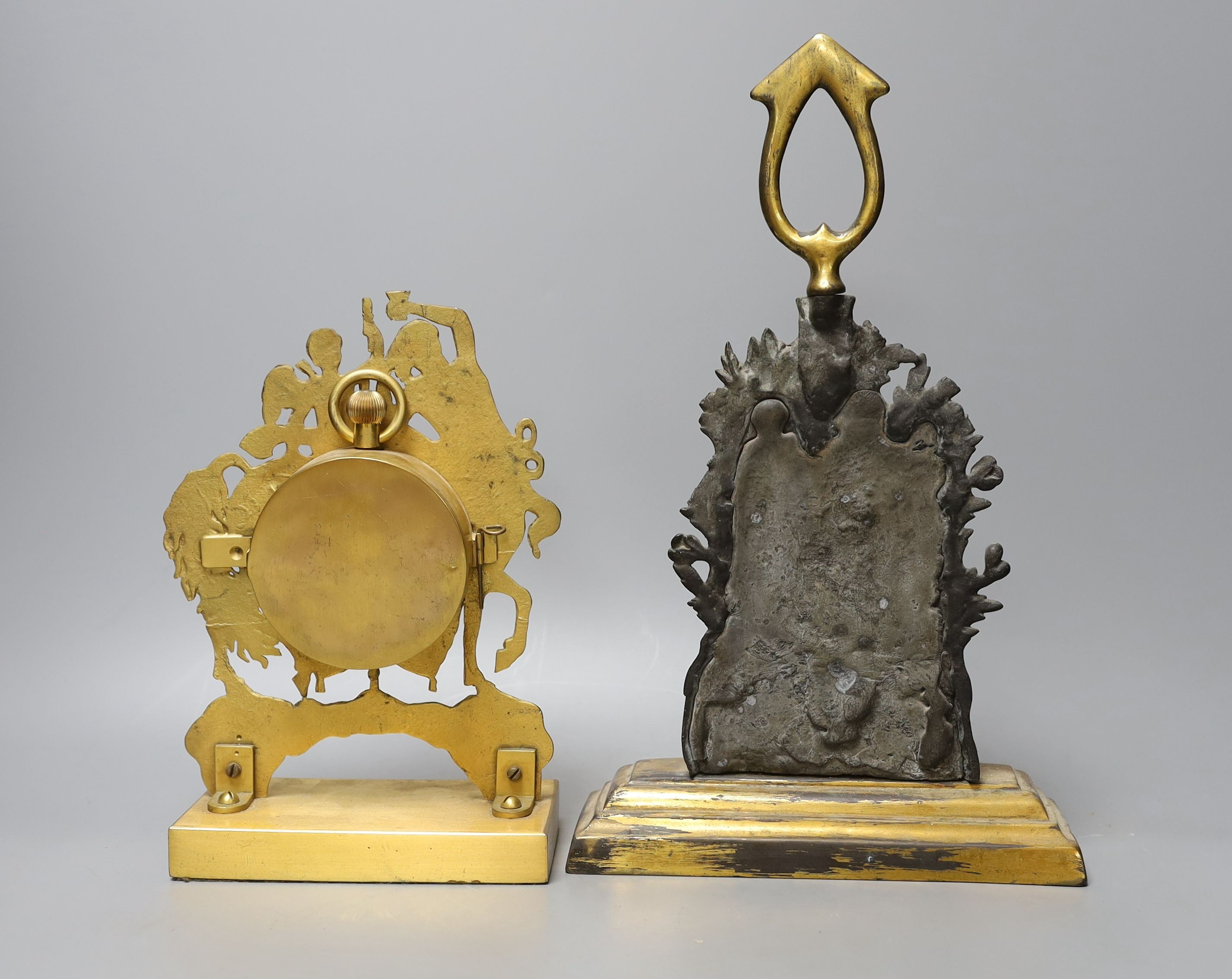 A gilt-metal Goliath pocket watch, in an Empire-style watch-stand, 23cm high, and a lead-weighted bronze door-stop